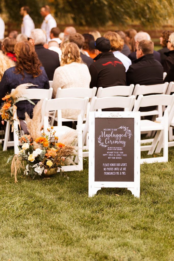 Unplugged ceremony sign at a Wisconsin fall wedding venue