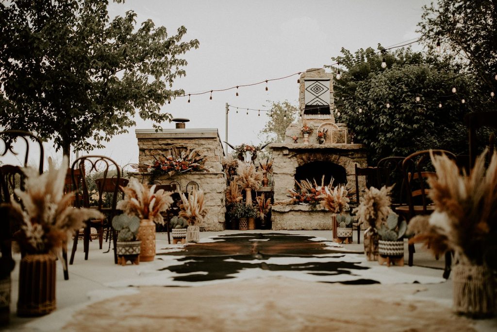 Western boho wedding ceremony with cowhides
